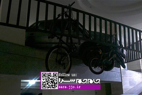 عملیات مهار خودروی معلق بین زمین و آسمان [+عکس]